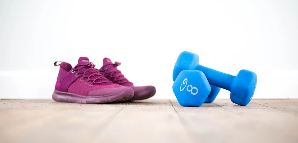 Knit running shoes on a wooden floor